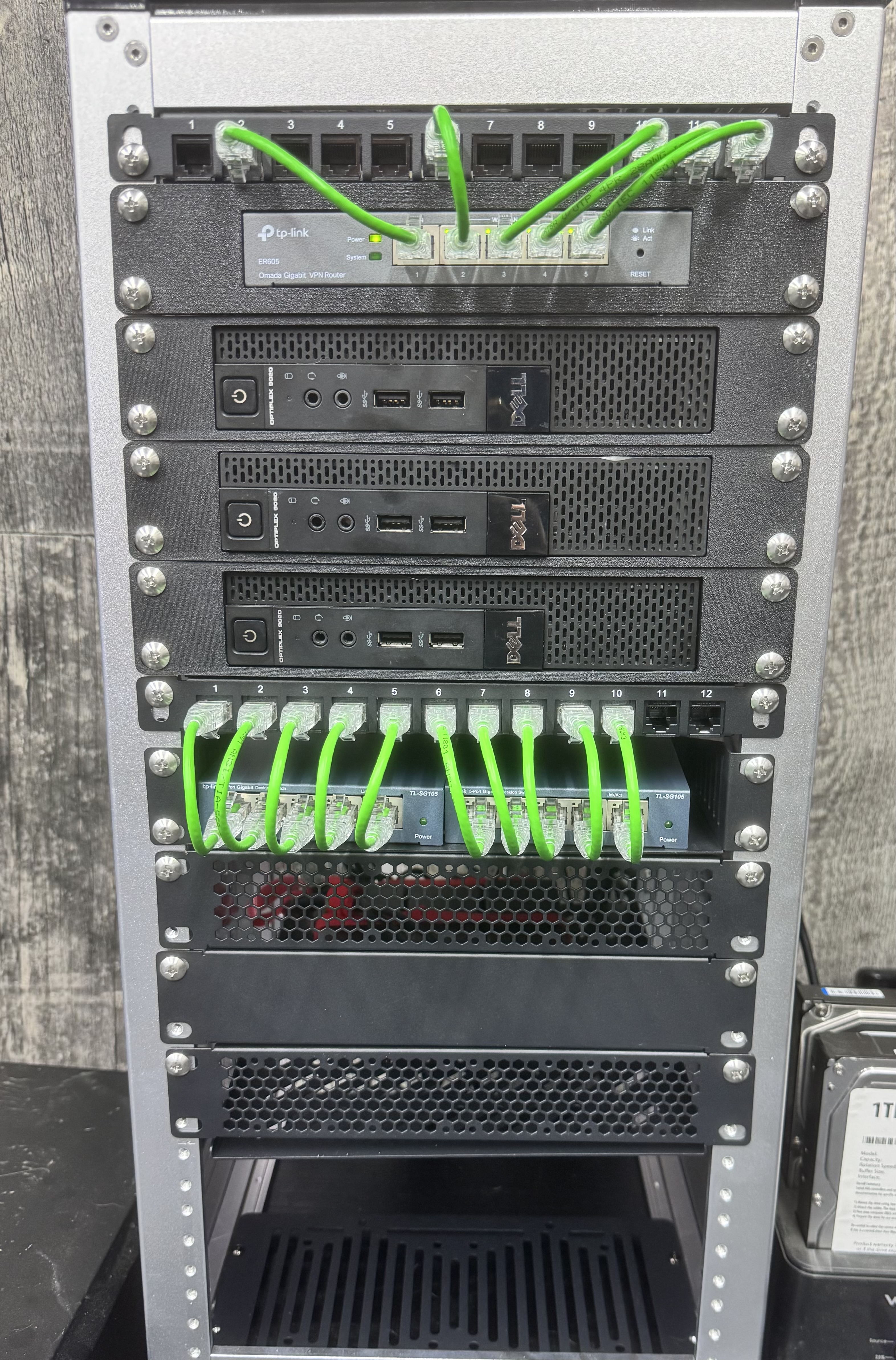 The original Rocknet rack: patch panel, TP-Link ER605 router, three Dell OptiPlex nodes and two TP-Link TL-SG105 switches