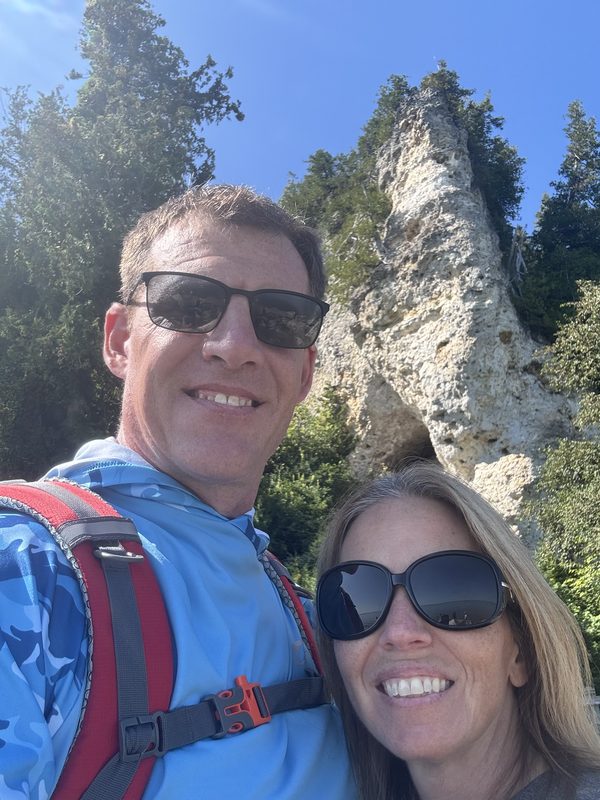 Keith Rockhill and his wife below a limestone rock formation on Mackinac Island